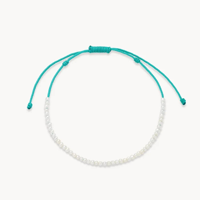 dainty teal pearl anklet - teal cord on white background