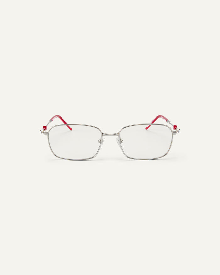 Face shot of Bonnie Clyde Dance Dance optical frames in silver and layered red with clear lenses.
