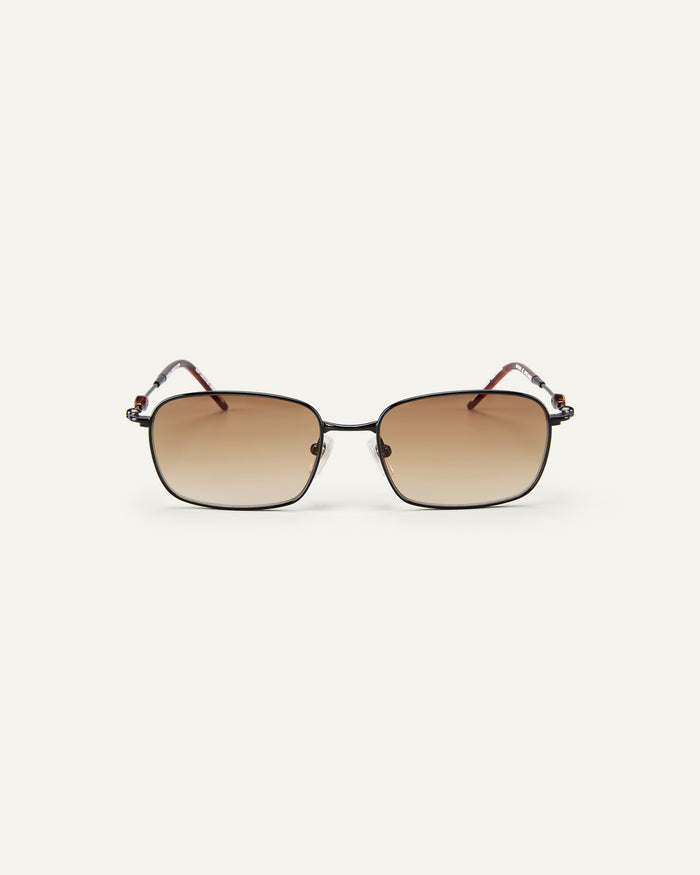 Face shot of Bonnie Clyde Dance Dance sunglasses in black and red tortoise with brown gradient lenses.