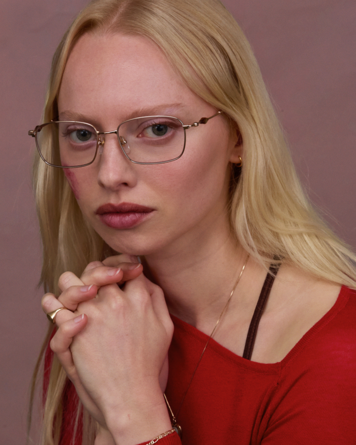 Quarter shot of Bonnie Clyde Dance Dance optical frames in gold and yellow tortoise with clear lenses.