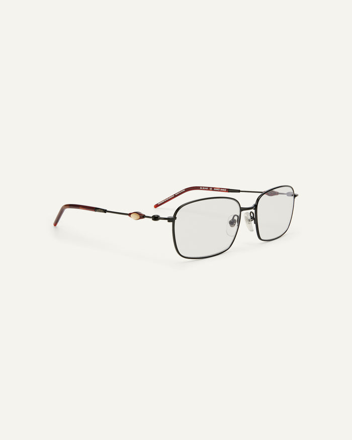 Side shot of Bonnie Clyde Dance Dance optical frames in black and red tortoise with clear lenses.