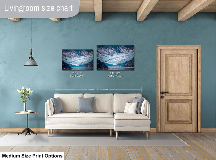 a living room with a white sofa, a wooden door, and a painting of a landscape on the wall. The living room appears to be designed for relaxation and comfort, with a focus on the artwork and the overall aesthetic.