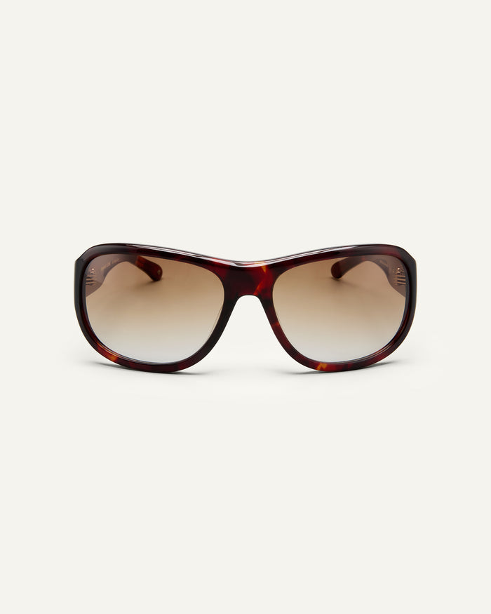 Face shot of Bonnie Clyde Dog sunglasses in red tortoise with brown gradient lenses.