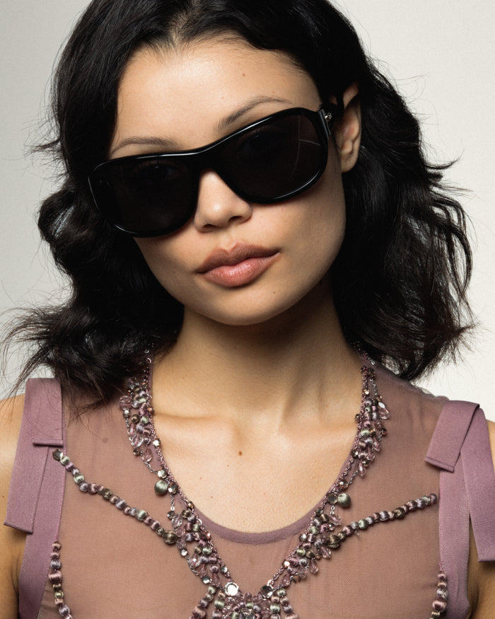 Quarter shot of Bonnie Clyde Dog sunglasses in black with black lenses.
