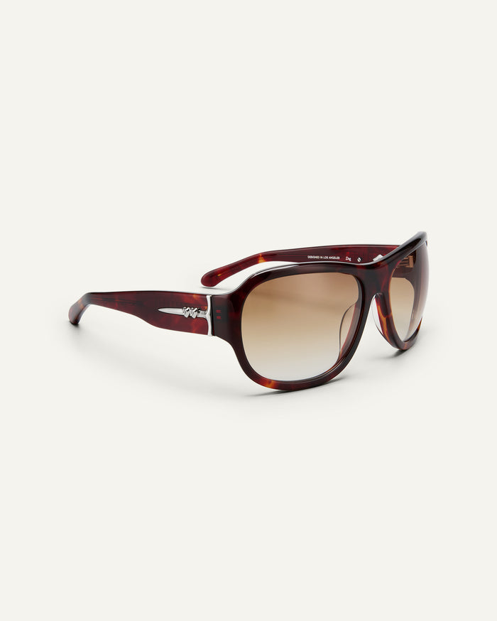 Side shot of Bonnie Clyde Dog sunglasses in red tortoise with brown gradient lenses.