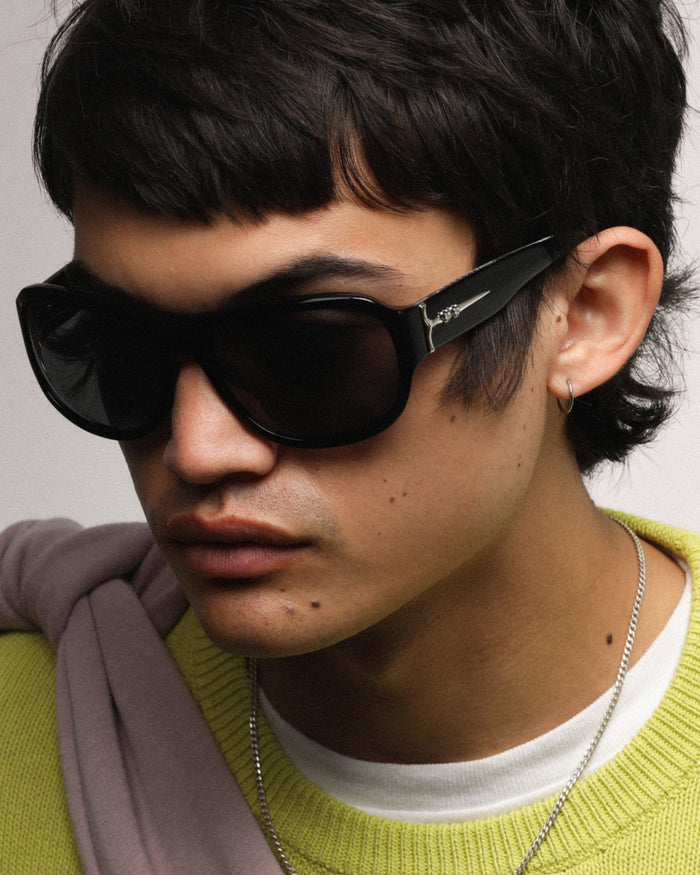 Close-up shot of Bonnie Clyde Dog sunglasses in black with black lenses.