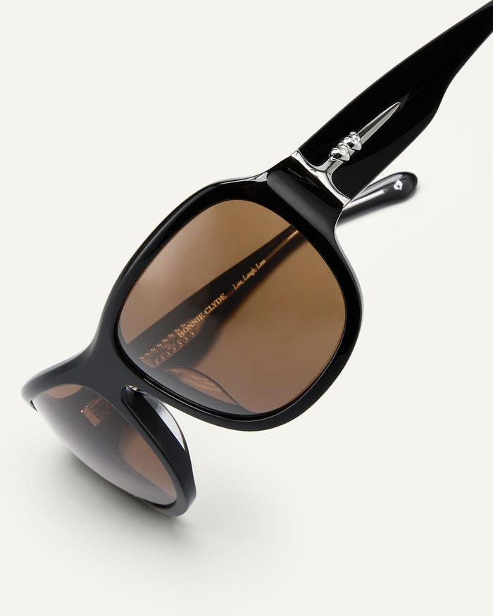 Side shot of Bonnie Clyde Dog sunglasses in black/brown.