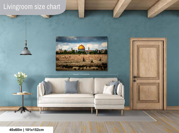 a living room with a large painting of the Dome of the Rock, a famous landmark in Jerusalem, hanging on the wall. The painting is approximately 40 inches wide and 115 centimeters tall. The room has a white sofa and a wooden door, creating a cozy and inviting atmosphere.