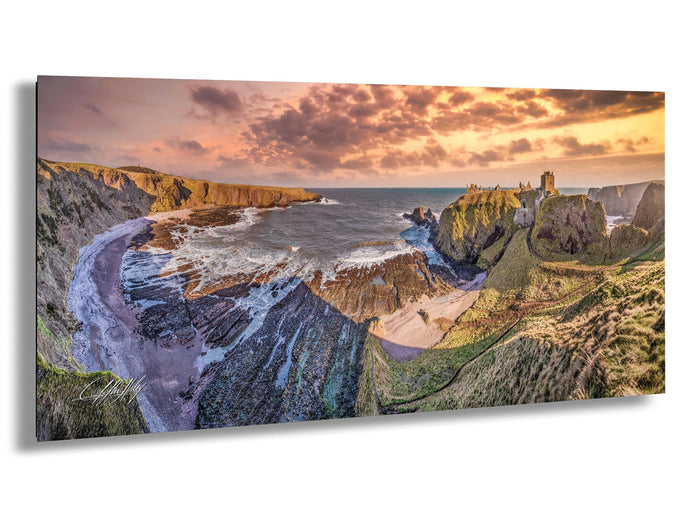 a stunning coastal landscape with rugged cliffs, a rocky shoreline, and a dramatic sky at sunset.