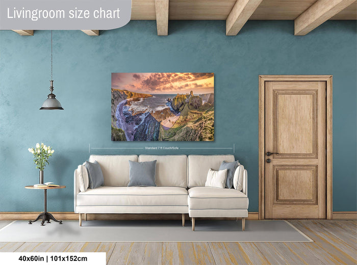 a living room with a large painting of a scenic landscape hanging on the wall. The painting is framed in white and measures 40 inches by 101.5 centimeters. The room has a wooden door, a white sofa, and a small table with a vase of flowers.