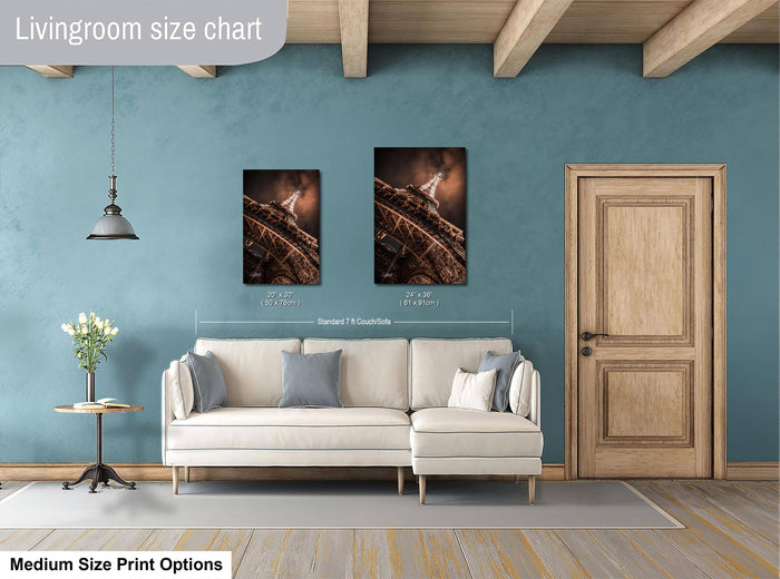 a living room with a white sofa, a wooden door, and a painting of a building on the wall. The living room appears to be modern and well-decorated.