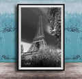 A black and white photograph of the Eiffel Tower in Paris, France, with a blue and white background.