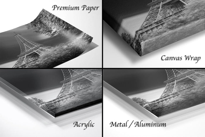 four different views of a black and white photograph of the Eiffel Tower, with each view labeled as either "Premium Paper", "Canvas Wrap", "Acrylic", or "Metal/Aluminum".