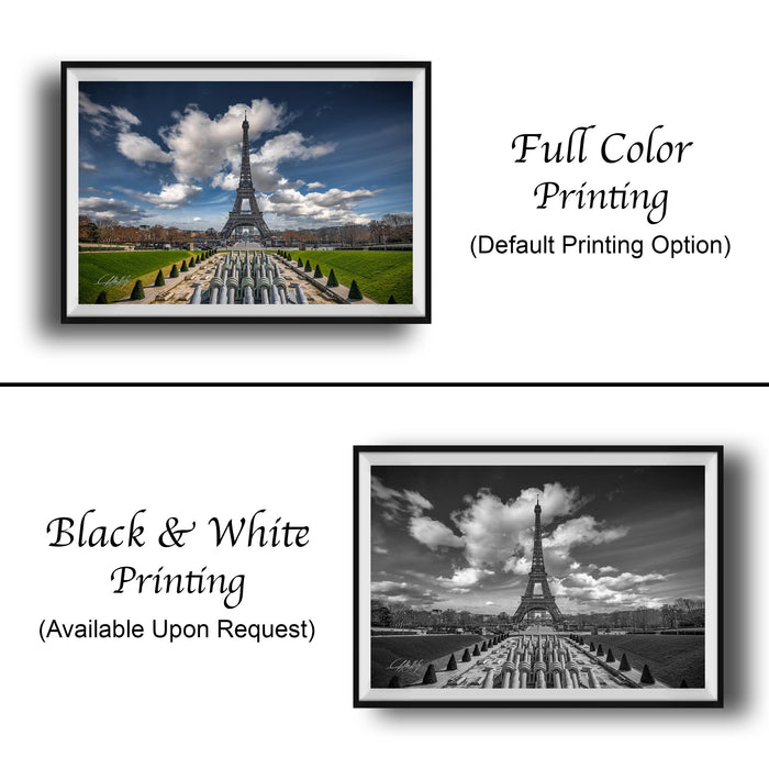 The image is a collage of two framed photographs. The top photograph is a full color print of the Eiffel Tower, while the bottom photograph is a black and white print of the same iconic landmark. Both images feature the Eiffel Tower prominently in the center, with a cloudy sky in the background. The text below the images indicates that the full color printing is available upon request, and the black and white version is also available.