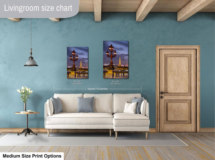 a living room with a white sofa, a wooden door, and a painting of a cityscape on the wall.