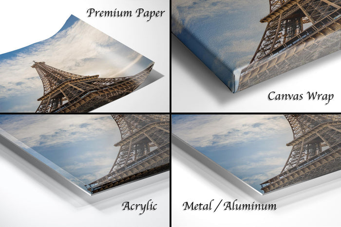 The image is a collage of four different views of the Eiffel Tower, with each view labeled as either "Premium Paper", "Canvas Wrap", "Acrylic", or "Metal/Aluminum".