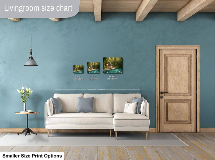 a living room with a white sofa, a wooden door, and a hanging light fixture. There are three framed artworks displayed on the wall, each with different sizes and dimensions. The living room appears to be designed for a smaller space, as indicated by the "Smaller Size Print Options" text at the bottom of the image.