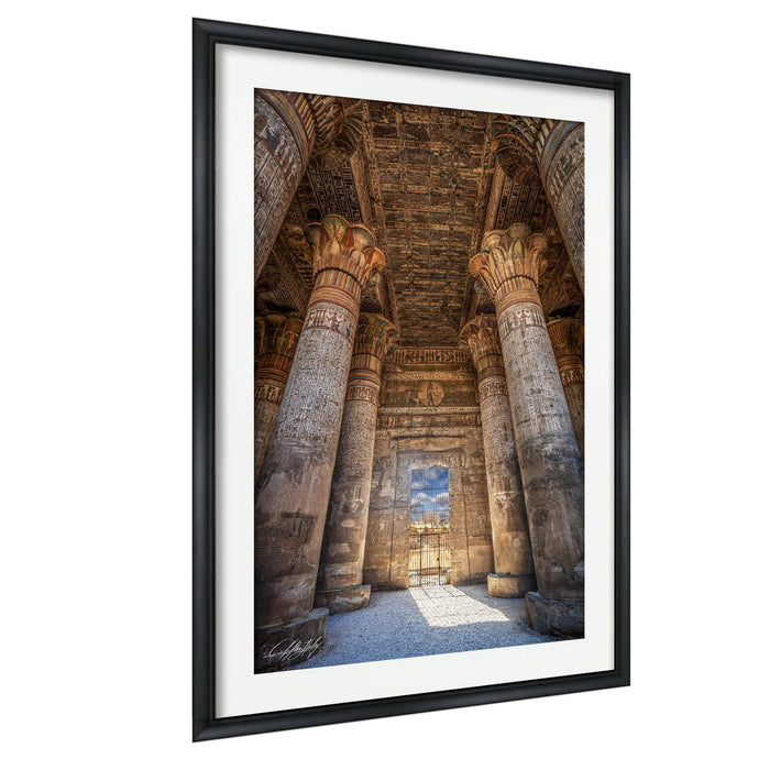 an ancient Egyptian temple with towering columns and intricate carvings, showcasing the architectural grandeur of this historical landmark.