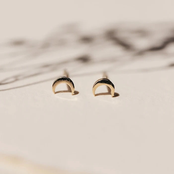 Everyday Little Crescent Moon Earring in 14k yellow gold, studio detail view
