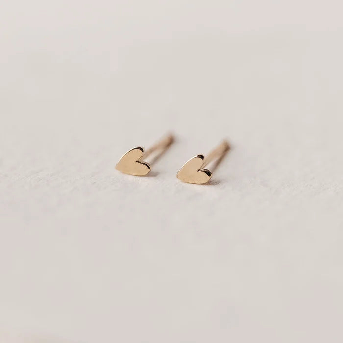 Everyday Little Lovely Heart Earring in 14k yellow gold, studio detail view
