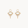 Front view of a pair of evil eye shaped earring charms with marquise-shaped rainbow moonstone at the centre and three small diamonds underneath followed by a small spike at the bottom displayed on a clean off-white background.