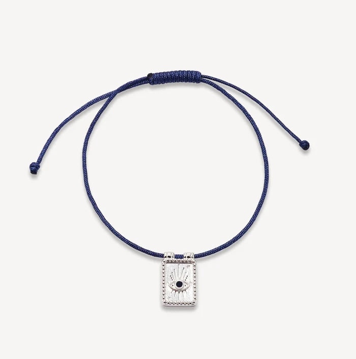 Evil Eye Plate Cord Bracelet in sterling silver with blue sapphire and soft blue cord