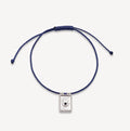 Evil Eye Plate Cord Bracelet in sterling silver with blue sapphire and soft blue cord