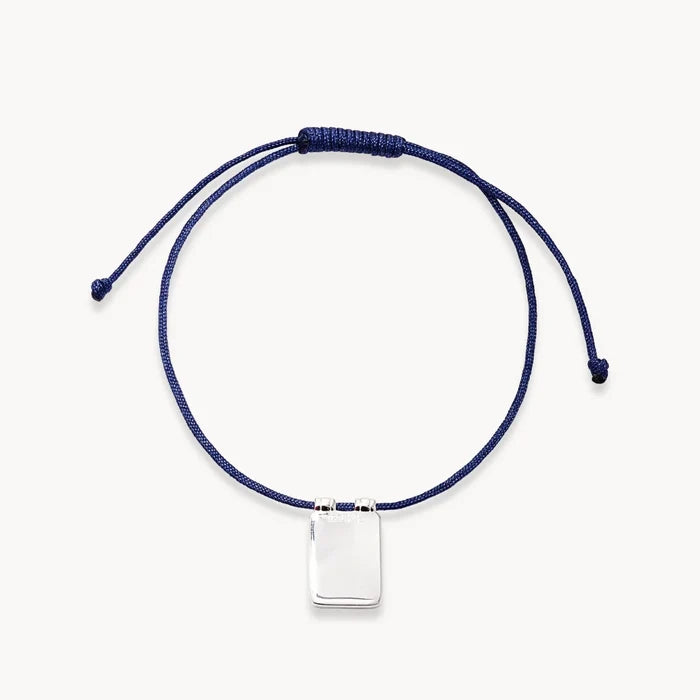 Evil Eye Plate Cord Bracelet in sterling silver with blue sapphire and soft blue cord, alternate angle detail view