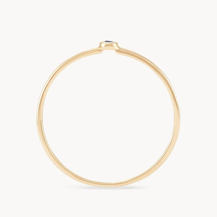 new bezel set serendipity blue sapphire  stacking ring - 10k yellow gold side view