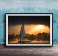 felucca sailboat art, nile river sunset print, luxor egypt fine art, egypt river photography, luxury travel wall art, serene river landscape, egyptian culture artwork, nile boat photography, sunset fine art print, timeless travel decor, historic river wall art, luxury collector photography, egypt fine art print, calming interior artwork