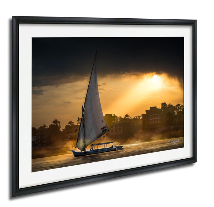 felucca sailboat art, nile river sunset print, luxor egypt fine art, egypt river photography, luxury travel wall art, serene river landscape, egyptian culture artwork, nile boat photography, sunset fine art print, timeless travel decor, historic river wall art, luxury collector photography, egypt fine art print, calming interior artwork