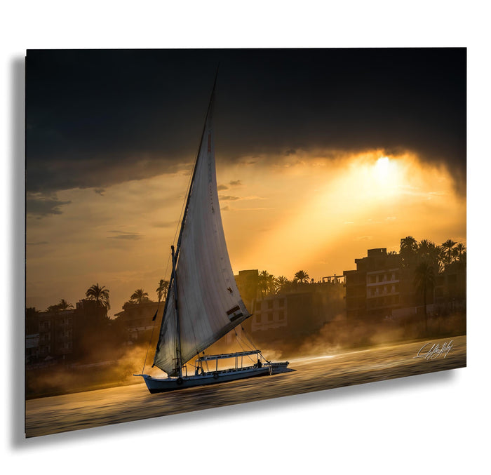 felucca sailboat art, nile river sunset print, luxor egypt fine art, egypt river photography, luxury travel wall art, serene river landscape, egyptian culture artwork, nile boat photography, sunset fine art print, timeless travel decor, historic river wall art, luxury collector photography, egypt fine art print, calming interior artwork