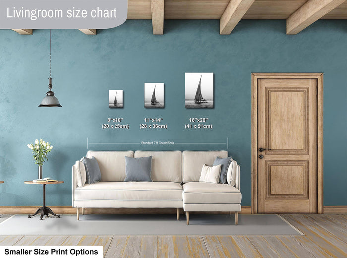 This luxury black and white fine art photograph captures a felucca sail boat drifting along the Nile River at sunset near Luxor, Egypt. Soft fog and minimalist composition create a timeless, monochrome aesthetic rooted in Egyptian river culture. Ideal for collectors and interior designers seeking refined, museum-quality wall art that embodies elegance, simplicity, and enduring calm.