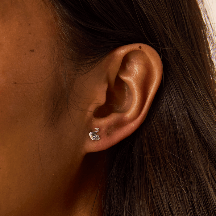 Floating Swan Studs in sterling silver with blue sapphire, alternate angle detail view