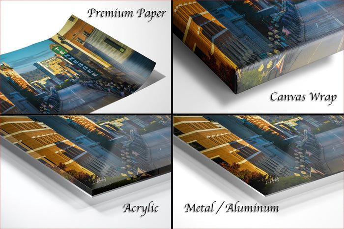 The image is a collage of four different views of a cityscape, each with a distinct perspective and angle. The collage includes a close-up view of the buildings, a wide-angle view of the city, a high-angle view of the city, and a low-angle view of the city. The collage is labeled as "Premium Paper", "Canvas Wrap", "Acrylic", and "Metal/Aluminum".
