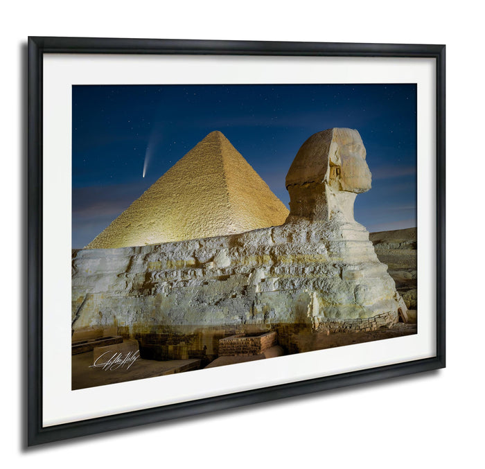the Great Pyramid of Giza and the Sphinx in Egypt, with the pyramids illuminated against a starry night sky.