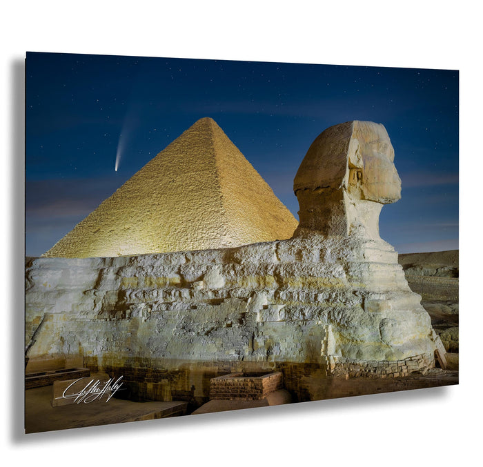 the Great Pyramid of Giza and the Sphinx, with the Great Pyramid standing tall against a starry night sky.