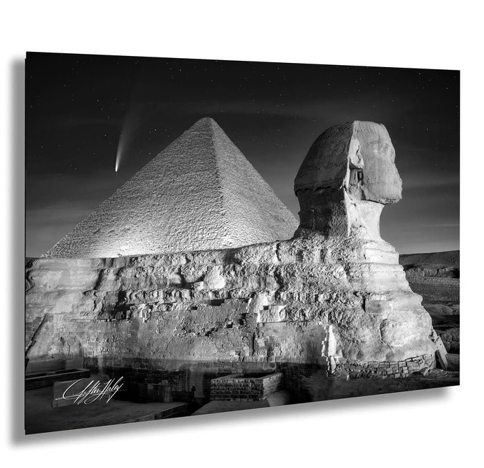 the Great Pyramid of Giza and the Sphinx, with a starry night sky in the background.