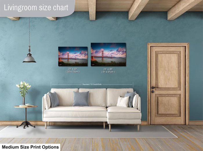 a living room with a white sofa, a wooden door, and a painting of the Golden Gate Bridge hanging on the wall.