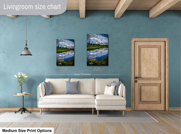 a living room with a white sofa, a wooden door, and a painting of a landscape on the wall.