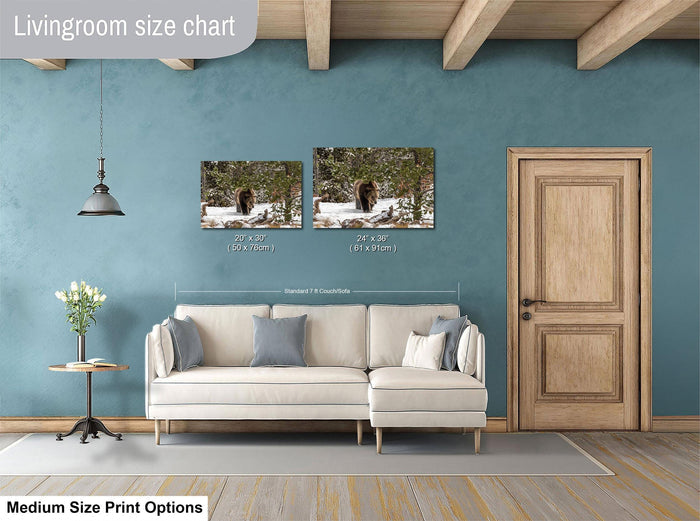 a living room with a white sofa, a wooden door, and a painting of a bear on the wall. The living room has a blue wall and a wooden floor.