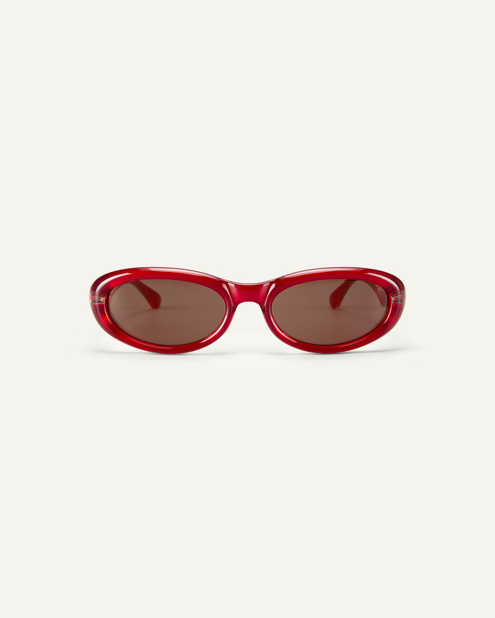 Face shot of Bonnie Clyde Groupie sunglasses in red with brown lenses.