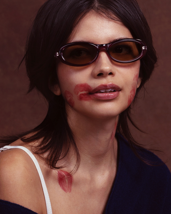 Quarter shot of Bonnie Clyde Groupie sunglasses in wine with olive lenses.