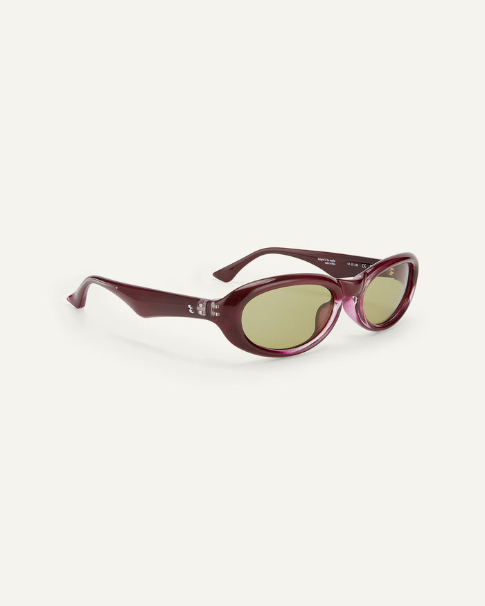 Side shot of Bonnie Clyde Groupie sunglasses in wine with olive lenses.