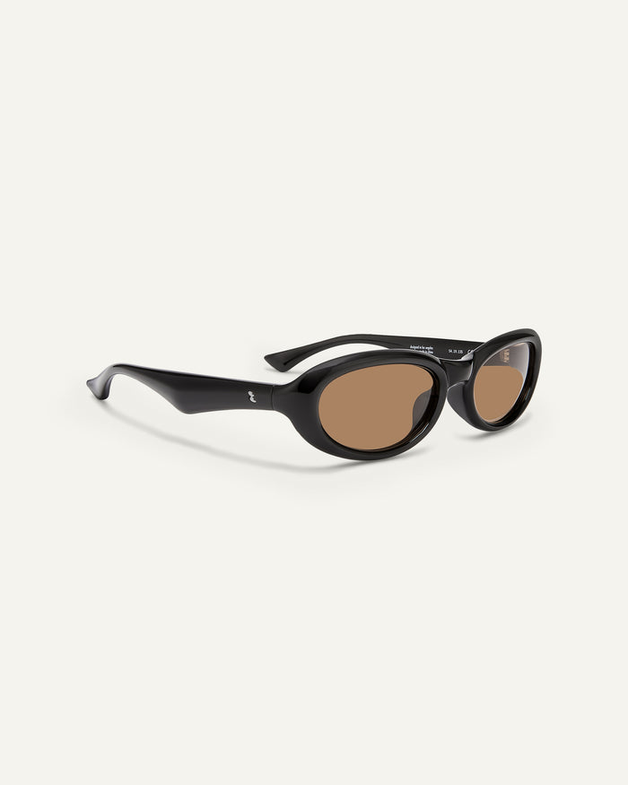 Side shot of Bonnie Clyde Groupie sunglasses in black with brown lenses.