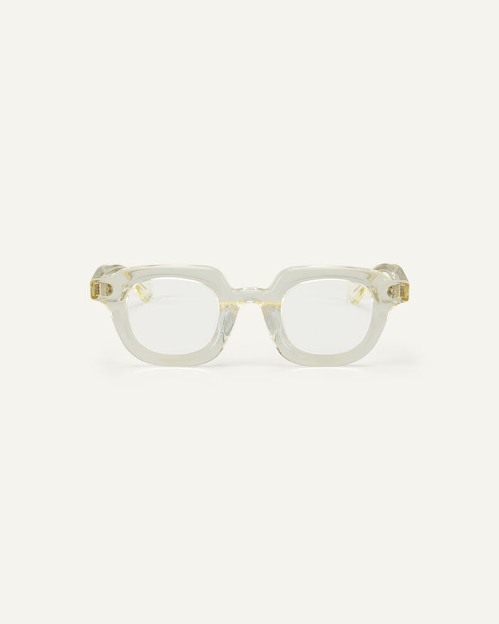 Face shot of Bonnie Clyde Gustave optical frames in transparent yellow with clear lenses.