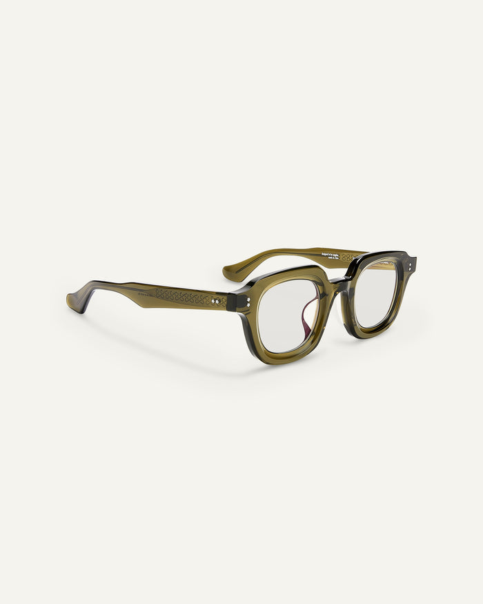 Side shot of Bonnie Clyde Gustave optical frames in dark green with clear lenses.