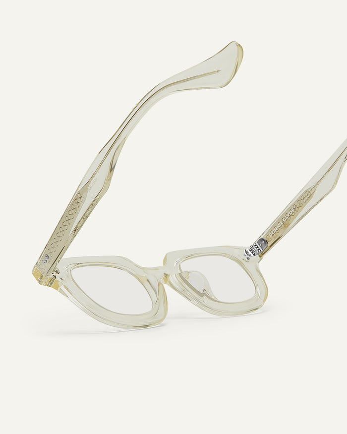 Close-up shot of Bonnie Clyde Gustave optical frames in transparent yellow with clear lenses.