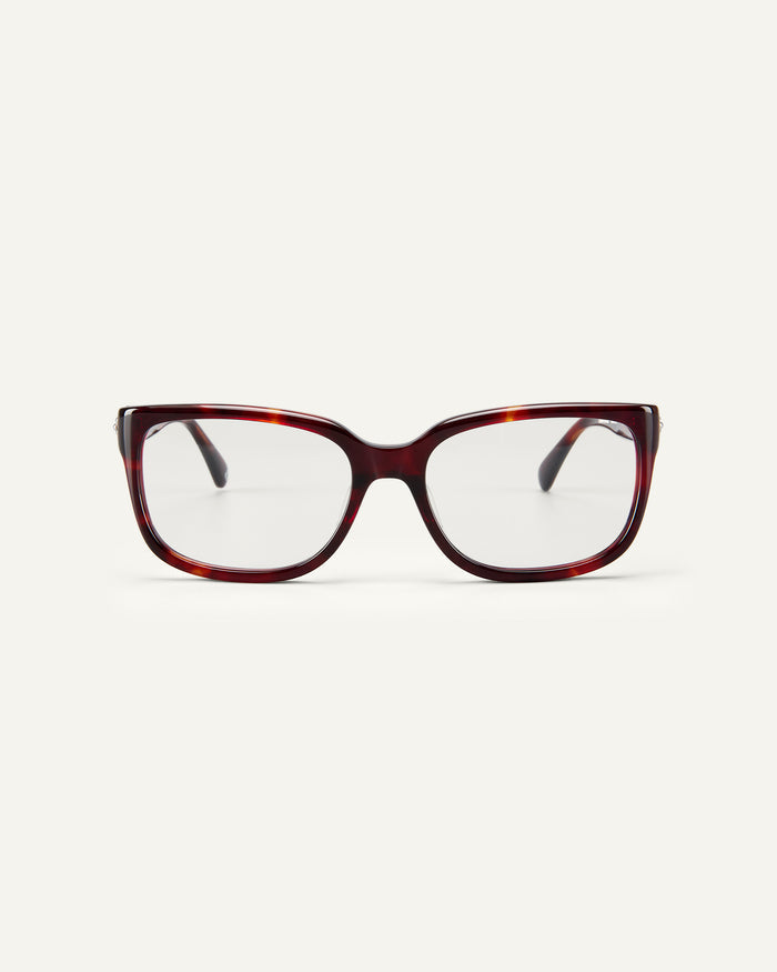 Face shot of Bonnie Clyde Guts optical frames in red tortoise with clear lenses.