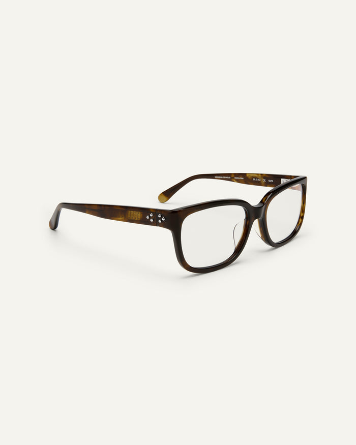 Quarter shot of Bonnie Clyde Guts optical frames in green tortoise with clear lenses.